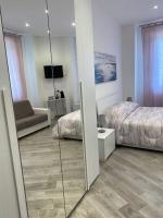 Posteľ alebo postele v izbe v ubytovaní Affittacamere La Riviera