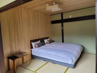 Onsen & Garden -Asante Inn-にあるベッド