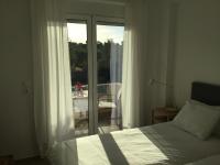 A bed or beds in a room at Oikia Ampavris