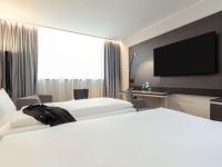 Novotel Duesseldorf Airportにあるベッド