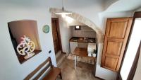 A kitchen or kitchenette at Capodigallo Holiday Trullo Monte Santo