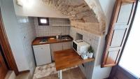 A kitchen or kitchenette at Capodigallo Holiday Trullo Monte Santo