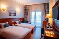 Postel nebo postele na pokoji v ubytování Lamar Azur Hotel