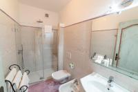 a bathroom with a shower and a sink and a toilet at Casa Teresa in Positano