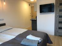 Posteľ alebo postele v izbe v ubytovaní Apartamenty "NaLetniej" Przy Morzu
