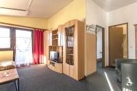 Televízia a/alebo spoločenská miestnosť v ubytovaní Family-Appartements