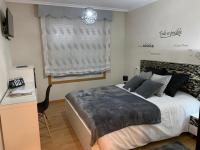 A bed or beds in a room at A&M Burela Costa
