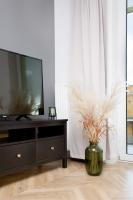 Televízia a/alebo spoločenská miestnosť v ubytovaní Oli&Joly Apartments