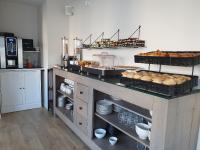 A kitchen or kitchenette at Logis Hotel La Closerie