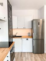 Kuchyňa alebo kuchynka v ubytovaní Apartamenty Oleńka I - Szczytno Mazury