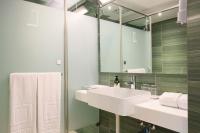 a bathroom with a sink and a mirror at Dandy Hotel - Tianmu Branch in Taipei