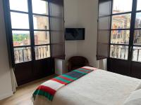 Posteľ alebo postele v izbe v ubytovaní Apartamentos Plaza Mayor Zamora