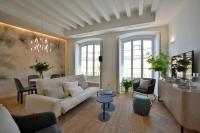 a living room with a couch and a table at Plaza Mina Suites - Adults Recommended by Luxury Suites Cadiz in Cádiz