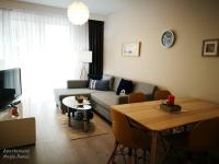 Televízia a/alebo spoločenská miestnosť v ubytovaní Apartament Magia Rewal