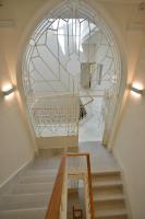 a stairway with a window and a stair case at Plaza Mina Suites - Adults Recommended by Luxury Suites Cadiz in Cádiz