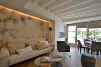 a living room with a couch and a table at Plaza Mina Suites - Adults Recommended by Luxury Suites Cadiz in Cádiz