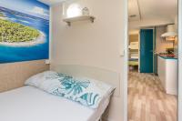 Posteľ alebo postele v izbe v ubytovaní West Coast Mobilhome with XXL Terrace