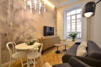 a living room with a couch and a table at Plaza Mina Suites - Adults Recommended by Luxury Suites Cadiz in Cádiz
