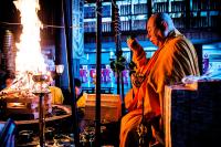a man standing in a barber shop with aperature at 清浄心院 in Koyasan
