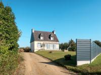 a house on a dirt road with a fence at Holiday Home Les Hortensias - KSD101 by Interhome in Kermaria-Sulard