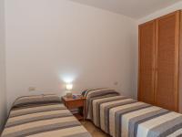 A bed or beds in a room at Holiday Home Dalia 20 - Vista Village by Interhome