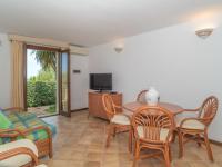 A television and/or entertainment centre at Holiday Home Dalia 20 - Vista Village by Interhome