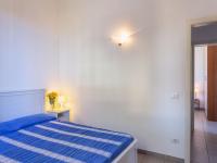 Łóżko lub łóżka w pokoju w obiekcie Villa Anita by Interhome