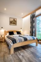 Posteľ alebo postele v izbe v ubytovaní Biały Miś Apartamenty Art & Design