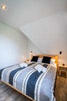 Posteľ alebo postele v izbe v ubytovaní Biały Miś Apartamenty Art & Design