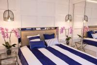 Posteľ alebo postele v izbe v ubytovaní Apartament Malibu Blue