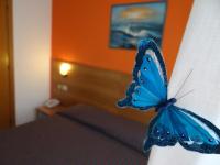 A bed or beds in a room at Hotel Amendola Fiera