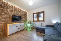 Televízia a/alebo spoločenská miestnosť v ubytovaní Apartamenty Bunny Aparts