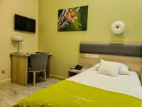 Televízia a/alebo spoločenská miestnosť v ubytovaní Antonińska Hotel & Apartamenty