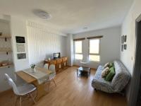 Televízia a/alebo spoločenská miestnosť v ubytovaní Apartamento Ginebra Sierra Nevada