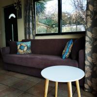 A seating area at MARMARI MEGALI AMMOS OASIS Apartment & Studio