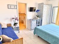 Łóżko lub łóżka w pokoju w obiekcie Resort Villa Flavio