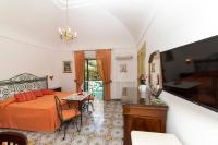 a bedroom with a bed and a table in a room at Casa Teresa in Positano