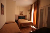 Posteľ alebo postele v izbe v ubytovaní Adams Hotel