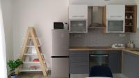 Kuchyň nebo kuchyňský kout v ubytování Urban Apartment Vukić