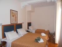 Posteľ alebo postele v izbe v ubytovaní Adams Hotel