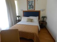 Posteľ alebo postele v izbe v ubytovaní Adams Hotel