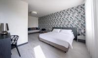 Posteľ alebo postele v izbe v ubytovaní Hotel Zenit