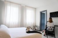 Posteľ alebo postele v izbe v ubytovaní Hotel Zenit