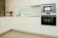 Kuchyň nebo kuchyňský kout v ubytování Light and Modern Sea View Apartment