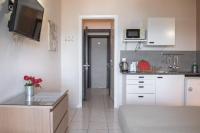 A kitchen or kitchenette at Galini Beach Studios and Penthouse