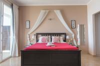 A bed or beds in a room at Galini Beach Studios and Penthouse