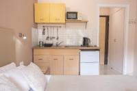 A kitchen or kitchenette at Galini Beach Studios and Penthouse