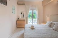 A bed or beds in a room at Galini Beach Studios and Penthouse