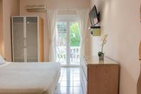 A bed or beds in a room at Galini Beach Studios and Penthouse
