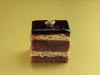 a piece of chocolate cake with a ring on top at Milano Verticale | UNA Esperienze in Milan